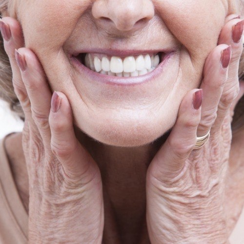 Smiling dentistry patient enjoying the benefits of dental implants