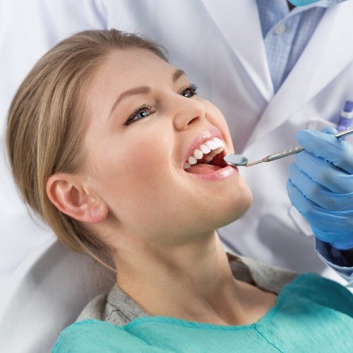 Woman smiling during preventive dentistry checkup and teeth cleaning