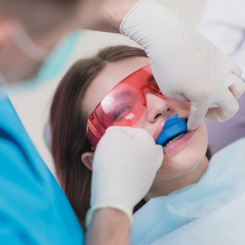 Dental patient receiving fluoride treatment