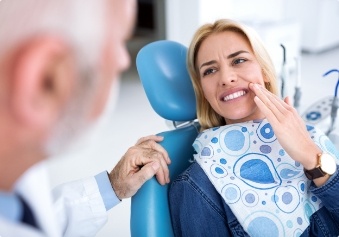 Woman in pain before wisdom tooth extraction