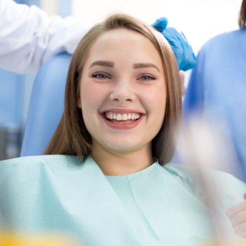 Woman smiling after wisdom tooth extraction