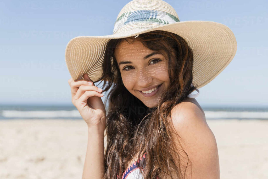 person on the beach smiling