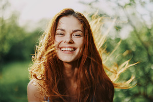 Someone smiling in a spring meadow